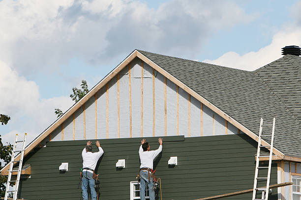 Professional Siding technician working in Harwick, PA